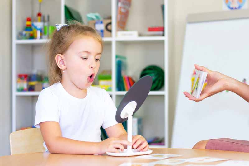 girl receiving speech therapy